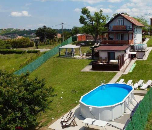 an aerial view of a house with a swimming pool at Avala Sunset Apartments in Belgrade