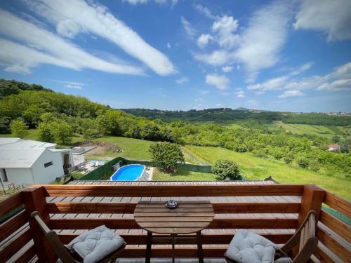 a balcony with a view of a swimming pool at Avala Sunset Apartments in Belgrade