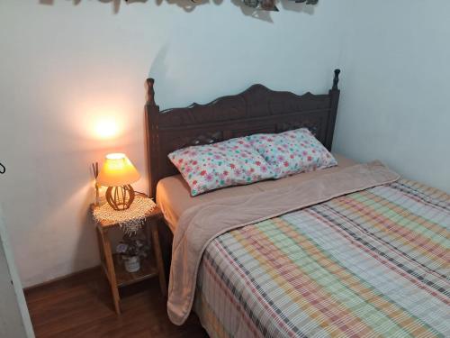 Ένα ή περισσότερα κρεβάτια σε δωμάτιο στο Dexa Hospedagem