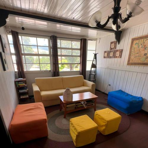 a living room with a couch and a coffee table at La Casa de Doña Cata in Bajo Boquete