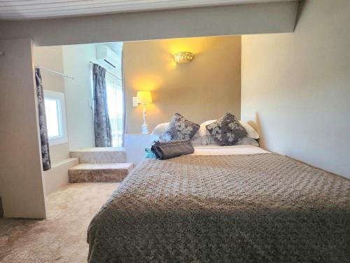a bedroom with a large bed in a room at La Belle Aurore in Sainte-Maxime