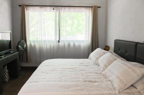 Ένα ή περισσότερα κρεβάτια σε δωμάτιο στο Hotel Boutique Canto De Piedra