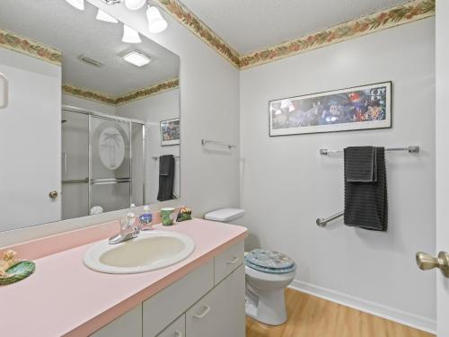 a white bathroom with a sink and a toilet at 1632 Z1 Village of Orange Blossom Gardens by REMAX Premier in The Villages