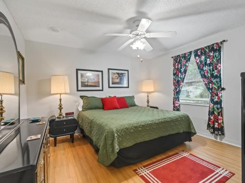 a bedroom with a bed and a ceiling fan at 1632 Z1 Village of Orange Blossom Gardens by REMAX Premier in The Villages