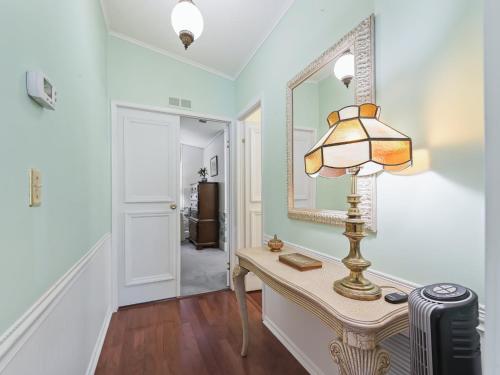 a room with a table with a lamp and a mirror at 1705 Z1 Village of Orange Blossom Gardens by REMAX Premier in The Villages