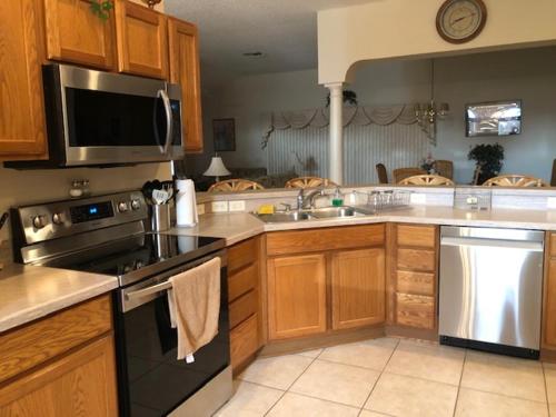 a kitchen with a sink and a stove top oven at 1506 Z2b VILLAGE OF SANTO DOMINGO by REMAX Premier in The Villages