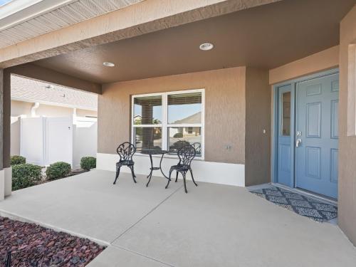 a patio with two chairs and a table in a house at 16837 Z2b Village of Woodbury by REMAX Premier in The Villages