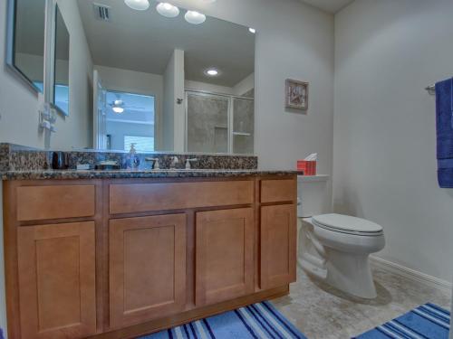 a bathroom with a sink and a toilet at 2463D Z4a VILLAGE OF COLLIER by REMAX Premier in The Villages