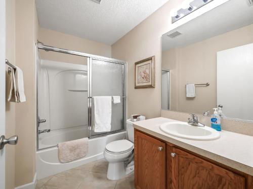 a bathroom with a sink and a toilet and a shower at 3496 Z2A VILLAGE OF SUMMERHILL by REMAX Premier in The Villages