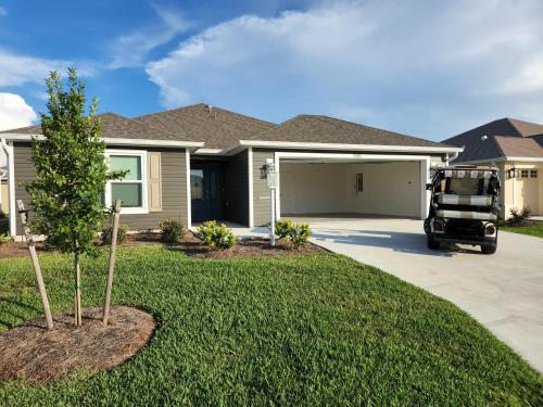 a truck parked in front of a house at 3 Bedroom 2 Bath Designer in The Villages