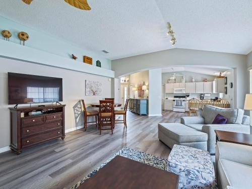a living room and kitchen with a couch and a table at 901 Z2b Villages of Rio Grande by REMAX Premier in The Villages