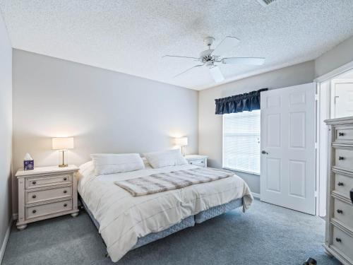 a bedroom with a bed and two dressers and a window at 901 Z2b Villages of Rio Grande by REMAX Premier in The Villages