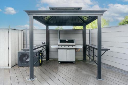 a gazebo with a grill and a stove on a deck at Lara Resort & Spa in Zepkow
