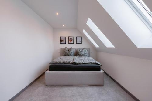a bedroom with a bed in a attic at Lara Resort & Spa in Zepkow