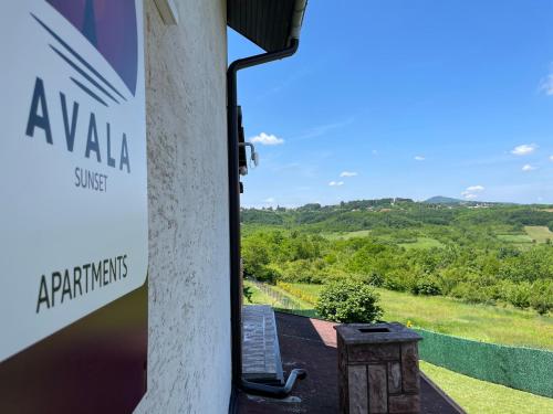 a view from the front door of aarmaarmaarmaarma house with a sign at Avala Sunset Apartments in Belgrade