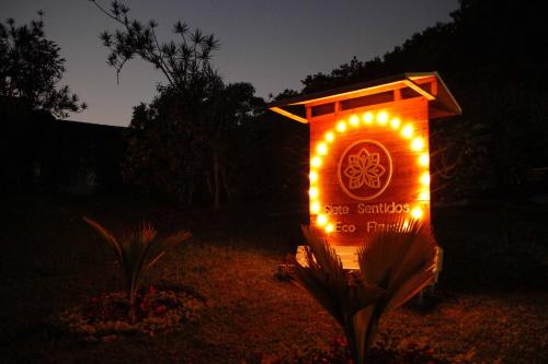 a sign with lights on it in the dark at Hacienda Siete Sentidos in La Mesa