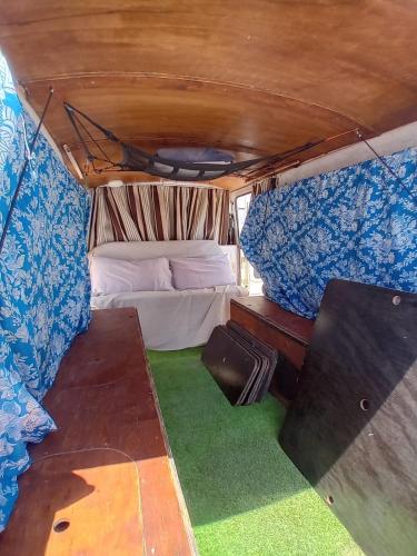 a room with a bed in the back of a van at Vintage Camper Van Explore Driving Mallorca - full equip in Palma de Mallorca