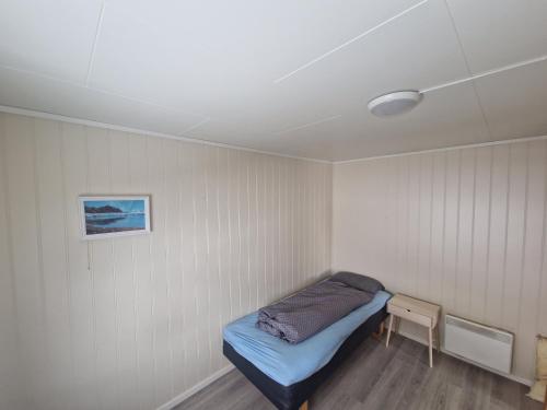 Postel nebo postele na pokoji v ubytování Gamle Fiskarheimen i Sund