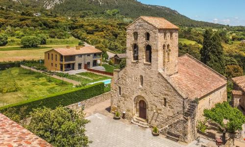 an aerial view of an old stone church at Els Majordoms - El Mont in Beuda