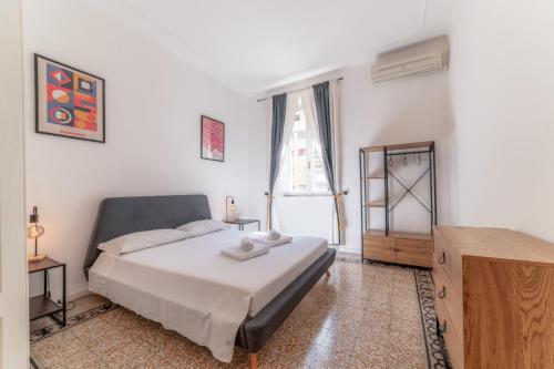 a bedroom with a large bed and a window at Elegant Apartments Palumbo in Rome