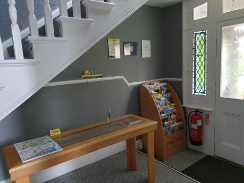 a stair room with a bench and a stair case at The Wycliffe in Folkestone