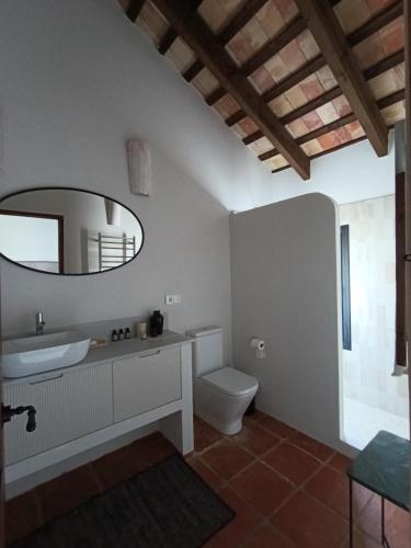 a bathroom with a sink and a mirror at Beautiful villa with private pool and mountain views in Jimena de la Frontera