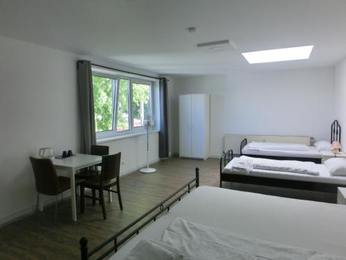 Ένα ή περισσότερα κρεβάτια σε δωμάτιο στο Hotel Rahlau