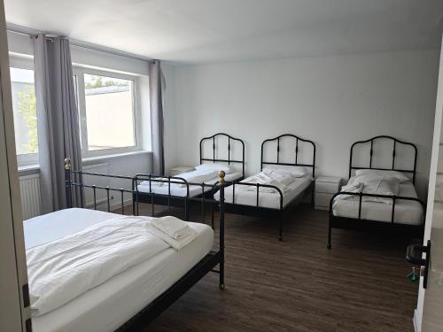 Ένα ή περισσότερα κρεβάτια σε δωμάτιο στο Hotel Rahlau