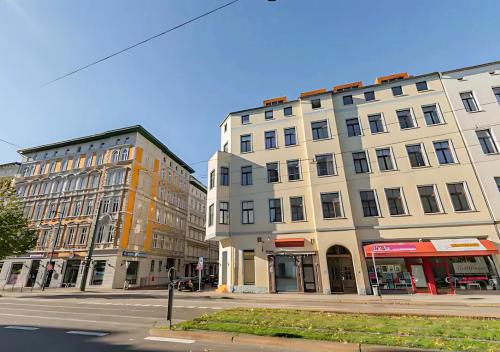 a group of buildings on a city street at Helle Wohnung in TOP-Lage, Hasselbachplatz - Altstadt, W-LAN, 4 Schlafplätze in Magdeburg