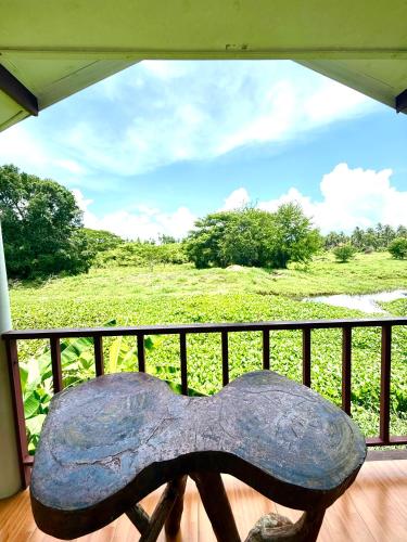 a statue of a horse sitting on a balcony at Wandee Resort Bankrut in Ban Krut