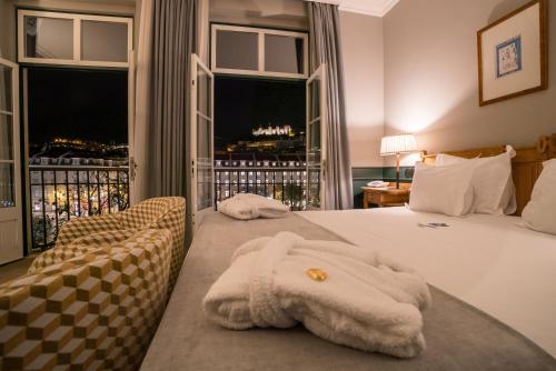 Ένα ή περισσότερα κρεβάτια σε δωμάτιο στο Hotel Metropole