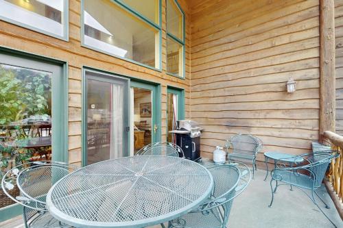 a table and chairs sitting on a patio at Ski Slopes and Scenic Views in Whitefish