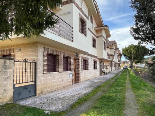 an empty street in front of a building at Las Eras in Talveila