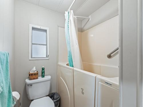 a bathroom with a toilet and a shower at 907 Z1 Village of Silver Lake by REMAX Premier in The Villages