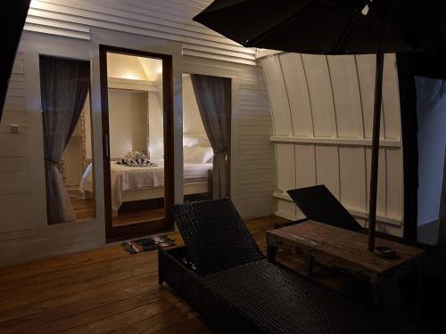 Ένα ή περισσότερα κρεβάτια σε δωμάτιο στο Gili Island Bungalow