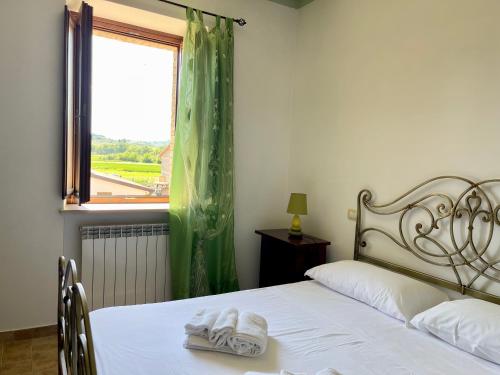 Cama o camas de una habitación en Casale Rotoloni