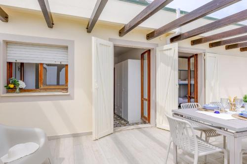 a kitchen and dining room with a table and chairs at Italian Experience-La Terrazza Sul Conero in Porto Recanati
