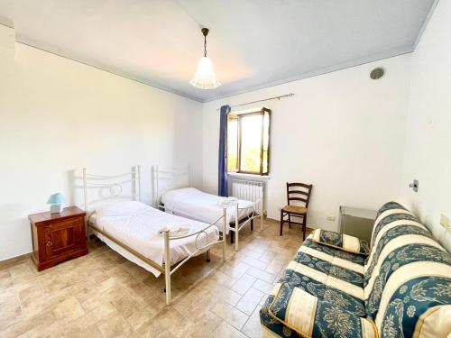Cama o camas de una habitación en Casale Rotoloni