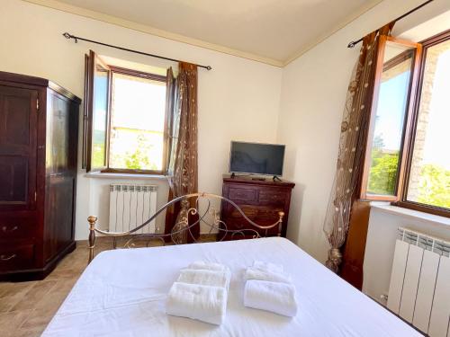 Cama o camas de una habitación en Casale Rotoloni