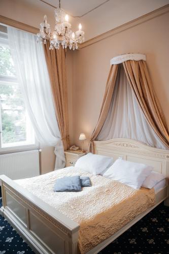 Postel nebo postele na pokoji v ubytování Alisa Hotel
