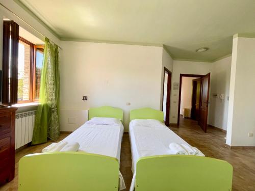 Cama o camas de una habitación en Casale Rotoloni