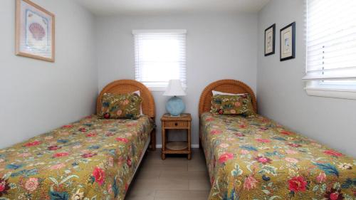 two beds sitting next to each other in a bedroom at 12 Mechanic St in West Cape May