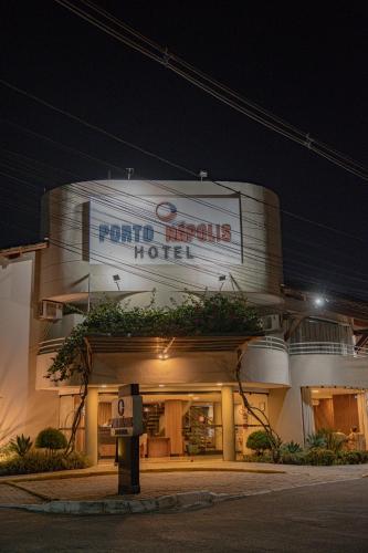 a front view of a hotel at night at Hotel Porto Napolis in Eunápolis