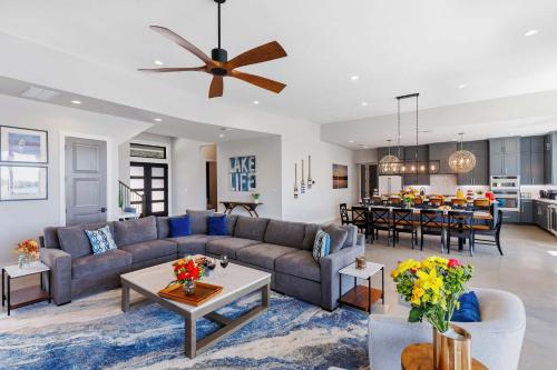 a living room with a couch and a table at Endless Sunset with Concierge Services in Marble Falls