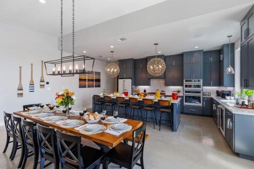 a kitchen with a large wooden table and chairs at Endless Sunset with Concierge Services in Marble Falls