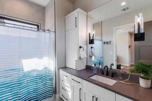 a bathroom with a sink and a mirror at Endless Sunset with Concierge Services in Marble Falls