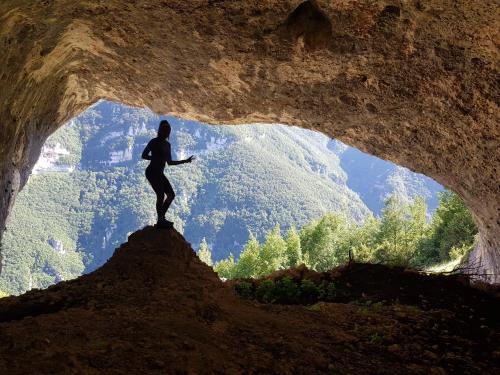 a person standing in front of a cave at Casa Avella Mountain Retreat in Pennapiedimonte