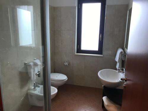 Koupelna v ubytování Gullo Hotel