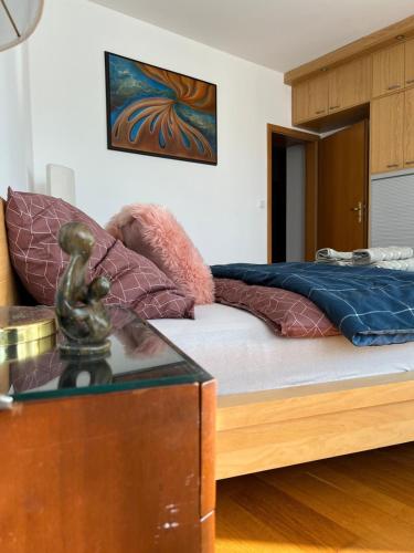 a bedroom with a bed and a glass table at A large 1 bedroom apartment with an available private parking in Prague