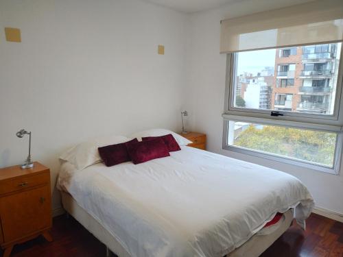 Postel nebo postele na pokoji v ubytování Bv Oroño Aparment 480